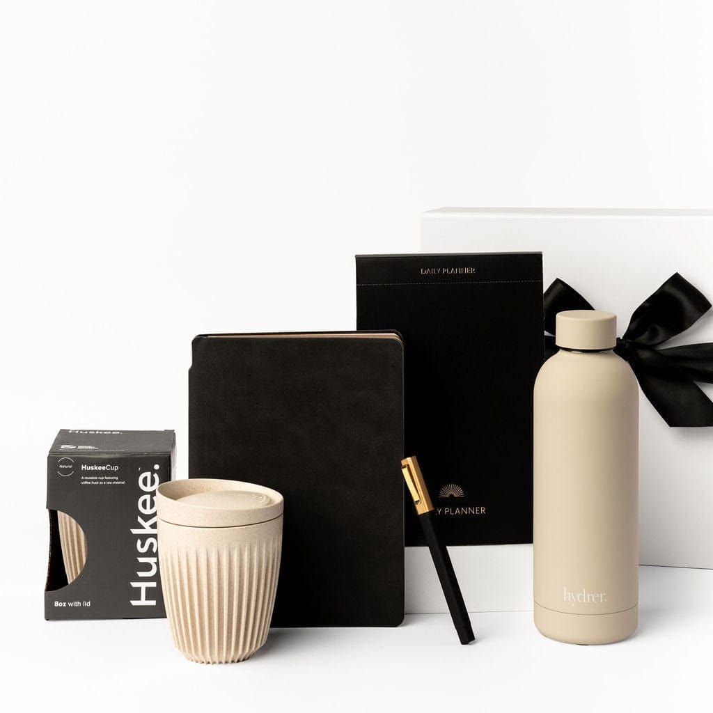 Huskee reusable coffee cup, soft touch A5 notebook, black daily planner, beige insulated drink bottle and gift box