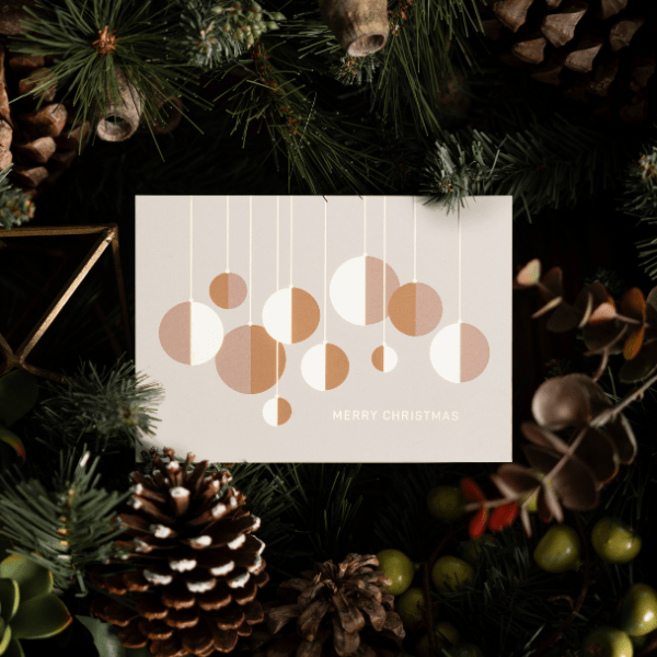 christmas gift card against pine tree background