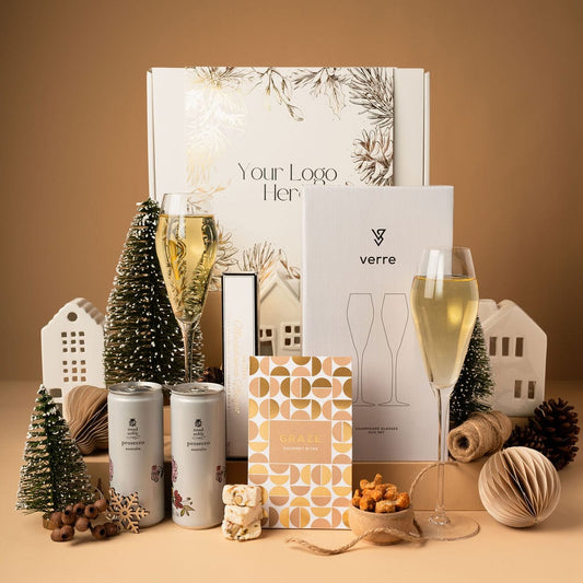 gold themed christmas gift with prosecco and champagne glasses 