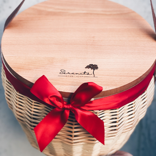 Ellar Boutique custom branded hotel and accommodation welcome gift - A reusable wicker picnic basket, beautifully packaged in reusable packaging, showcasing the company's branding. 1