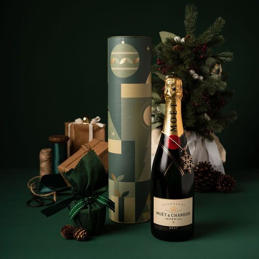 green christmas cylinder gift with alcohol and pudding 