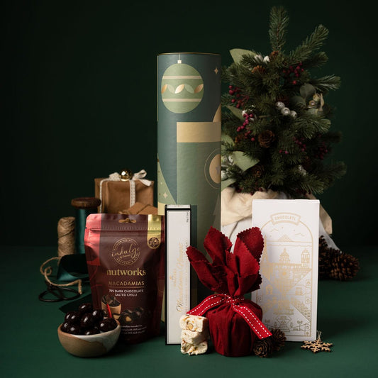 red and green christmas gift in cylinder packaging 
