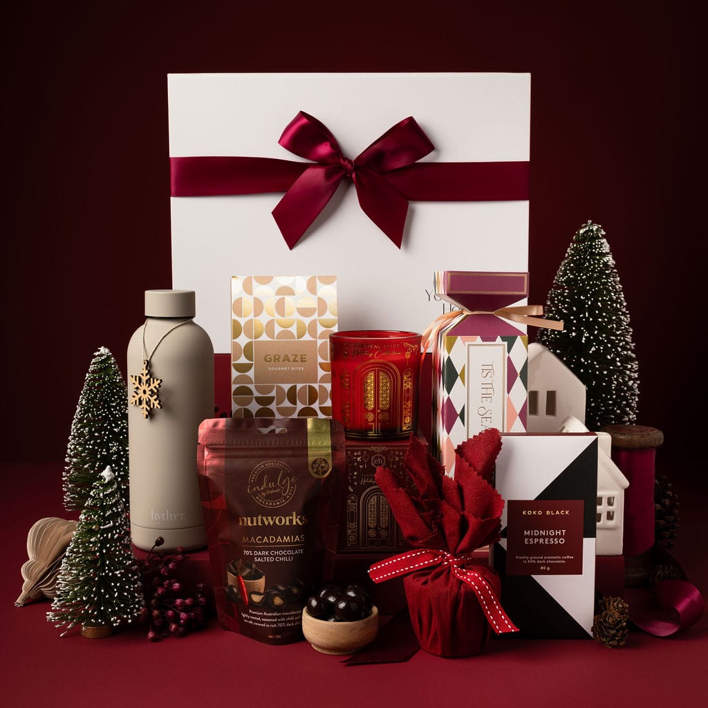 christmas gift red theme with pudding, bon bon, chocolate and candle