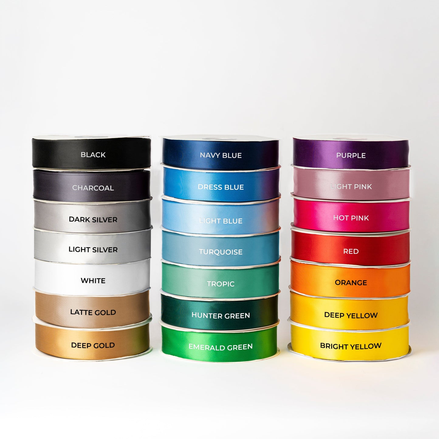 ribbon rolls stacked on top of each other in different colours and labelled