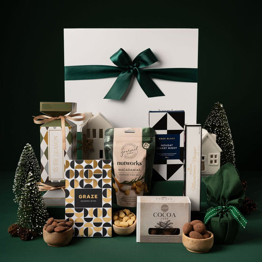 green themed christmas gift with contents on display 