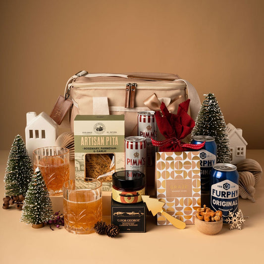 cooler bag gift with alcohol and contents on display against gold background 