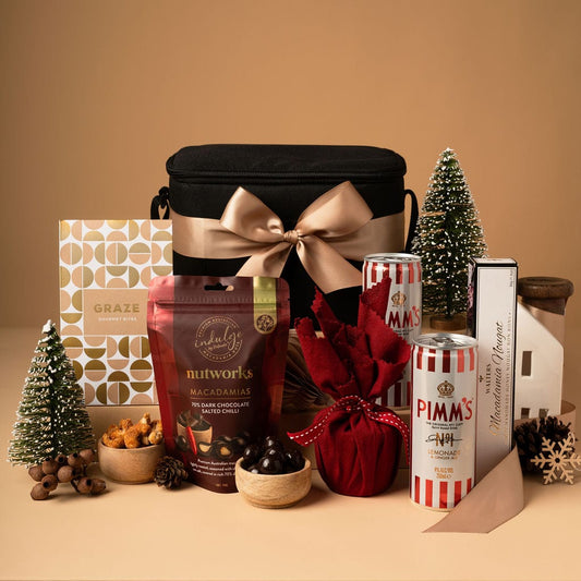 gold themed christmas cooler bag gift with chocolate, nougat and alcohol 