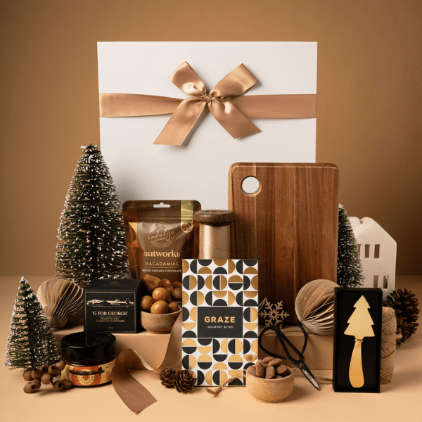 gold themed christmas gift with chopping board, chocolate and gold knife 